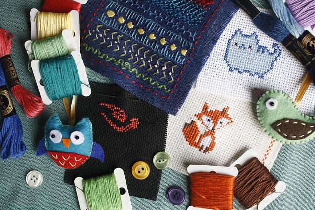 Small colorful modern cross-stitch motifs of a cat, fox, and bird