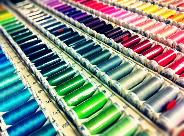 Rows of colorful embroidery floss spools
