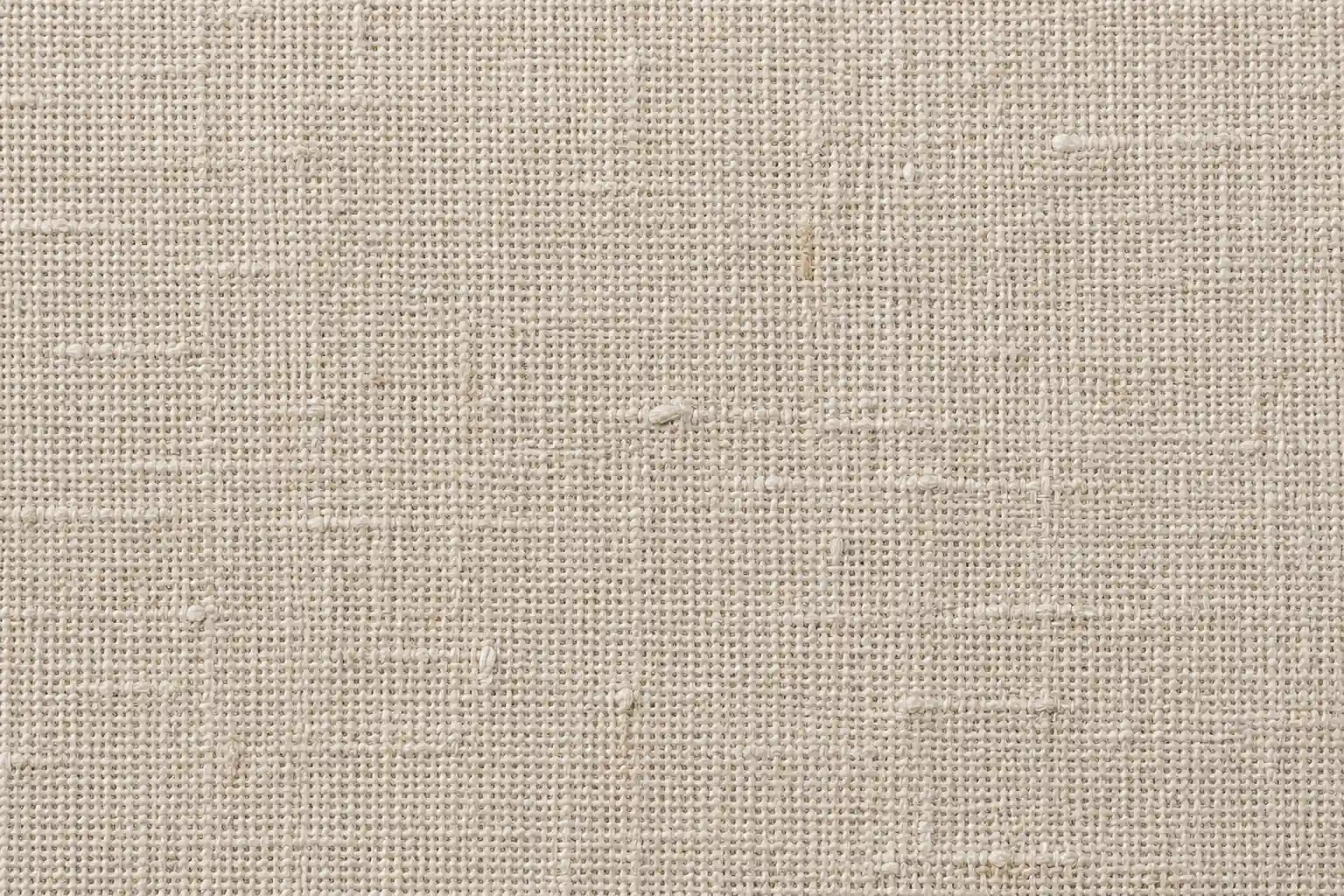 A close-up of natural linen fabric showing its characteristic slubby texture