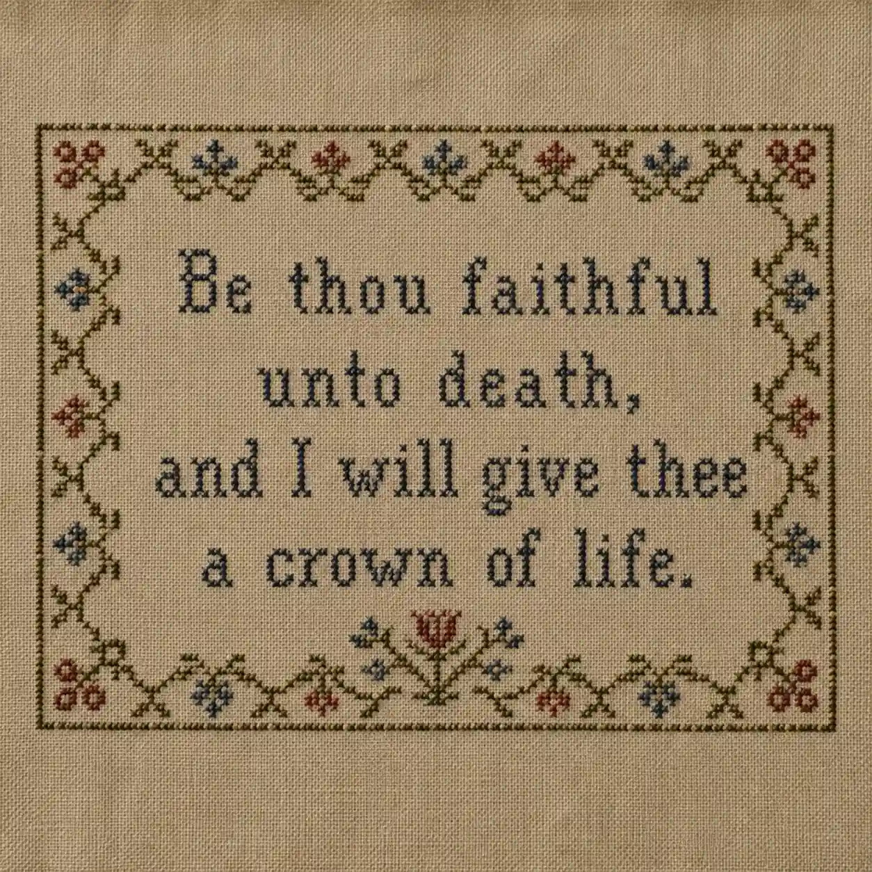 A short stitched verse framed by a simple floral border